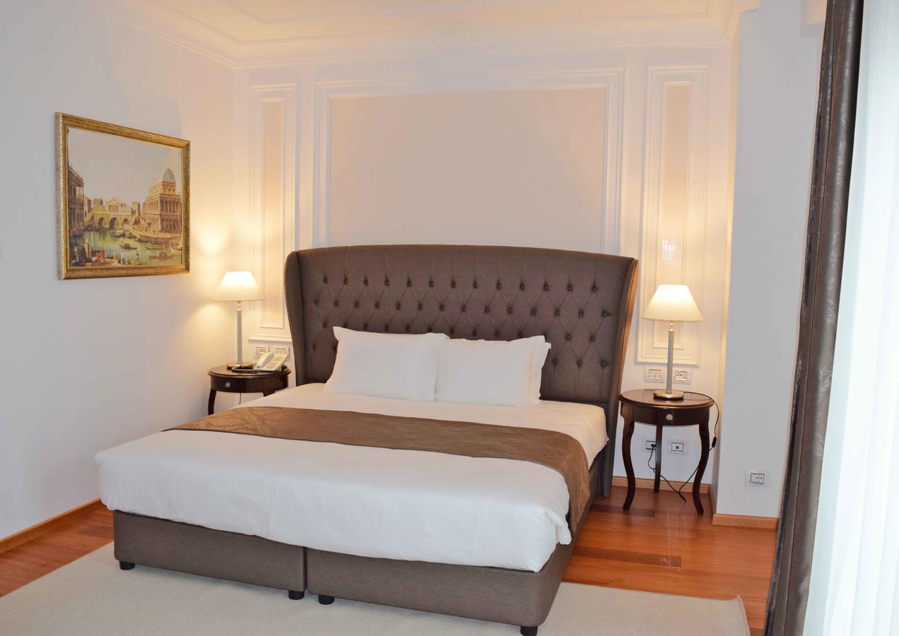 Xheko Imperial Luxury Hotel & Spa Tiranë Ngoại thất bức ảnh A bedroom at the hotel
