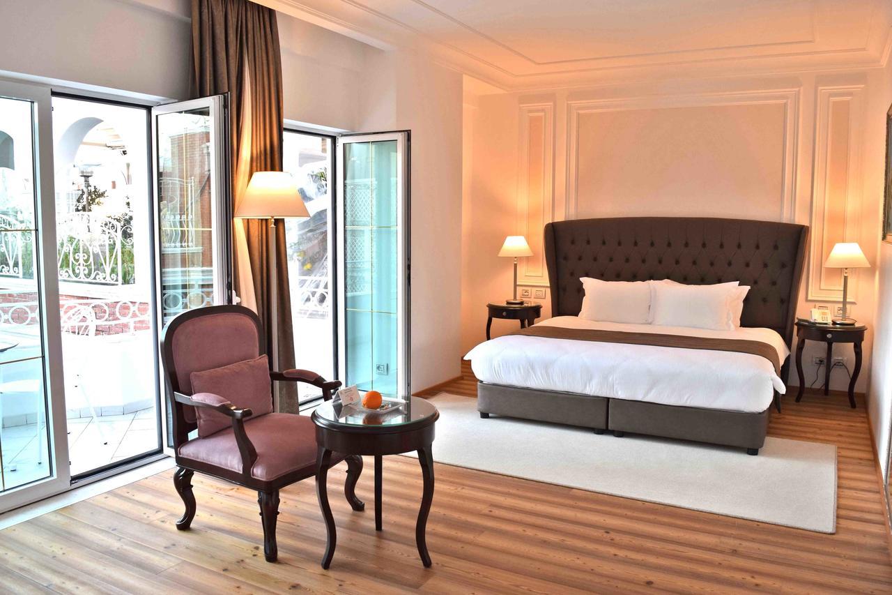Xheko Imperial Luxury Hotel & Spa Tiranë Ngoại thất bức ảnh A bedroom at the hotel