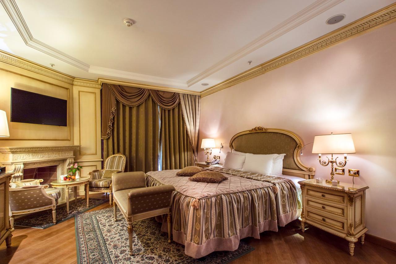 Xheko Imperial Luxury Hotel & Spa Tiranë Ngoại thất bức ảnh A bedroom at the hotel